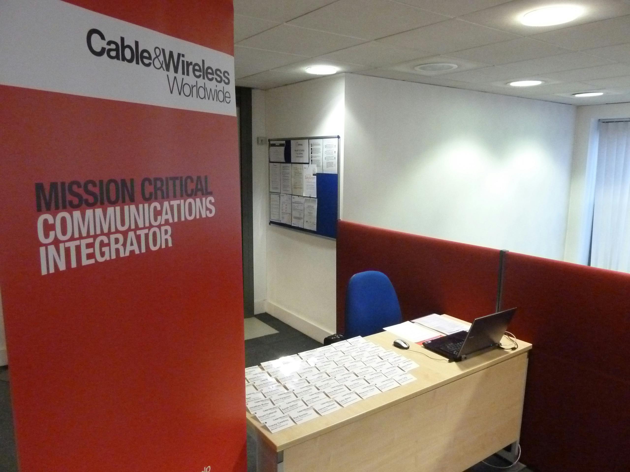 Conference Suite at Liverpool Gateway, featuring a clean desk and Cable & Wireless banner.