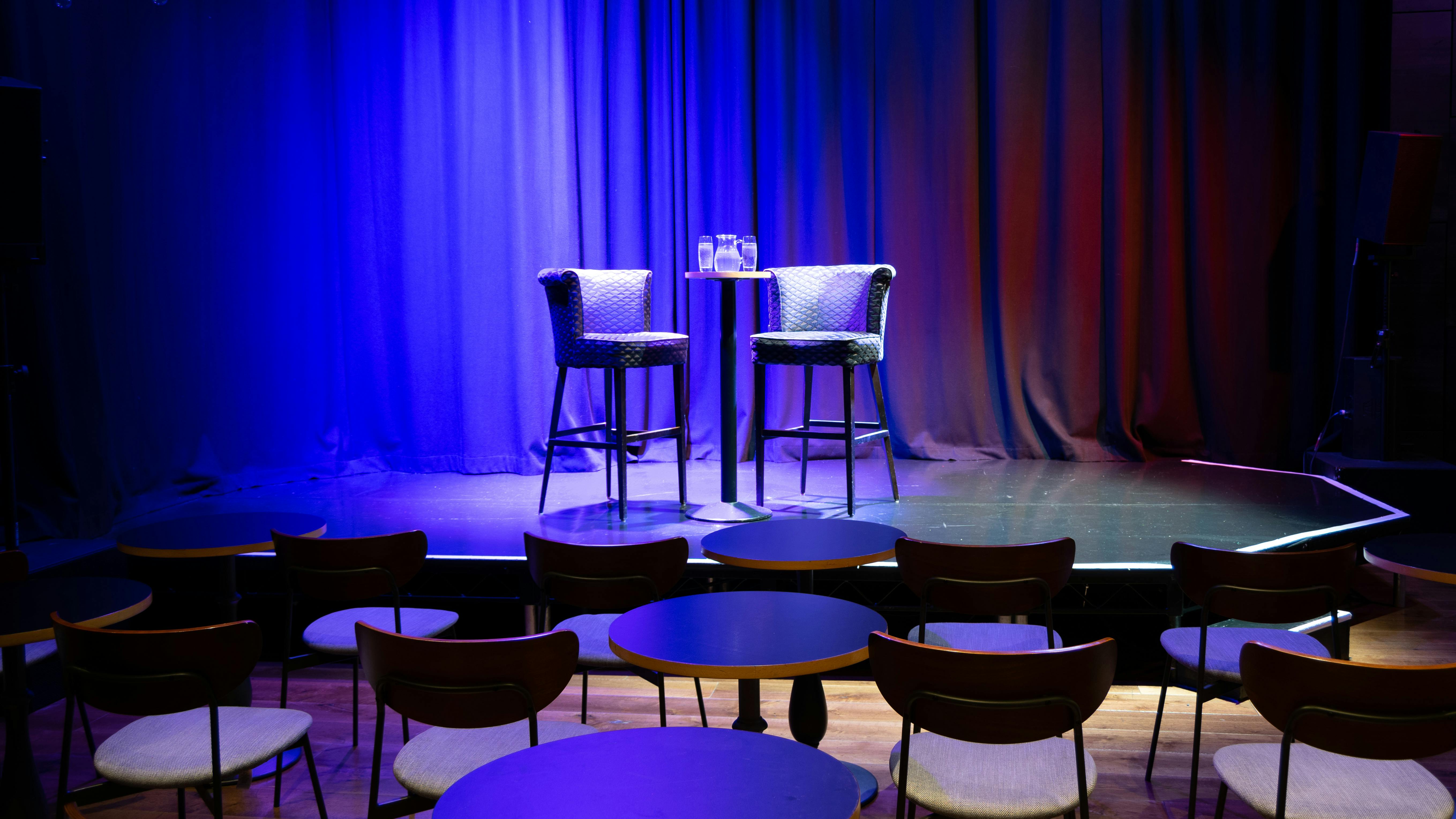 Intimate stage setup with stools for panel discussions at The Other Palace Theatre.