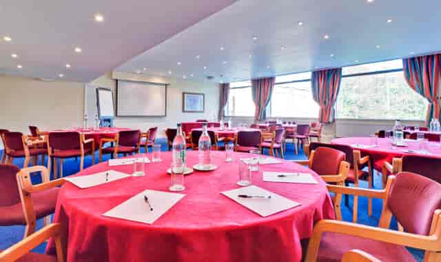 Calthorpe Suite meeting space with round tables, ideal for workshops and events.