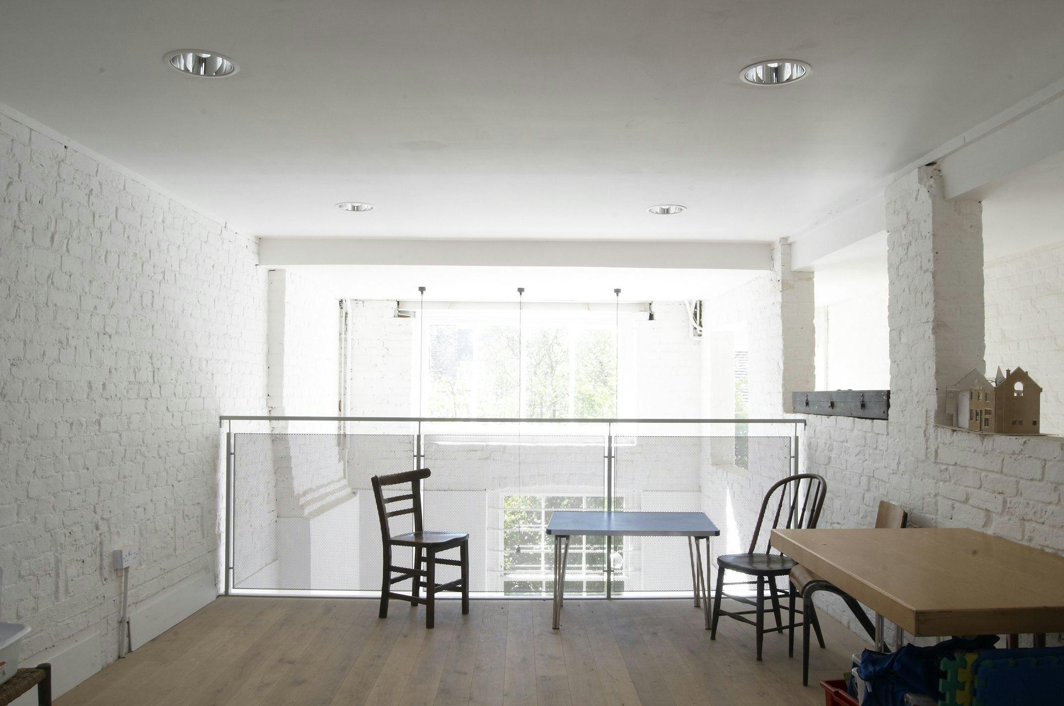 Bright minimalist meeting space in Saint Barnabas Dalston, perfect for workshops and gatherings.