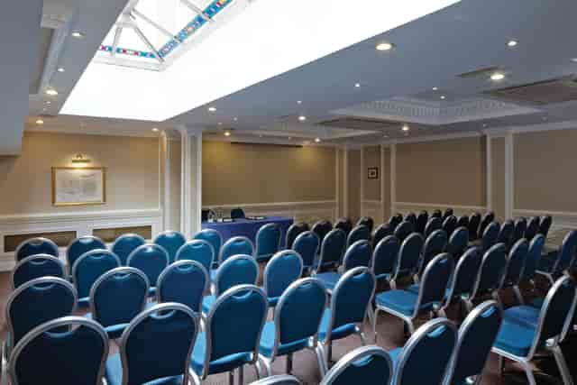 Theater-style Portland Suite with skylight for corporate meetings and business events.