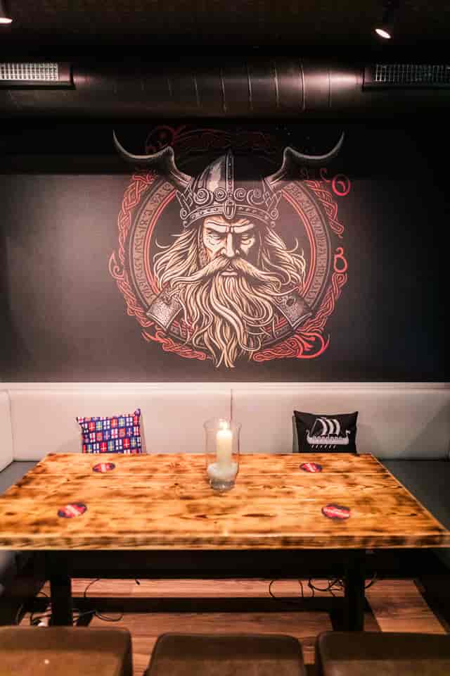 Nordic Bar meeting space with king mural, ideal for creative events and gatherings.