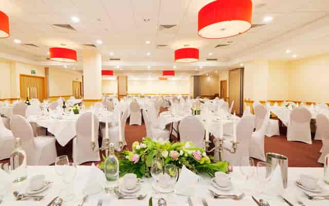 Pimlico Events Space banquet hall with red lighting for professional formal events and galas.