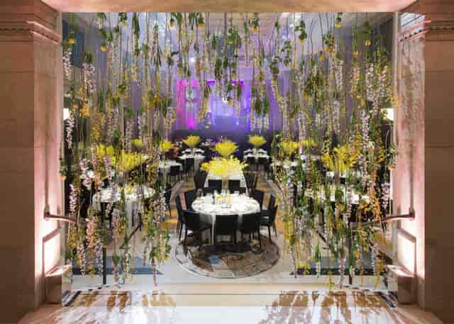 Elegant event space with floral decor, perfect for upscale gatherings and celebrations.