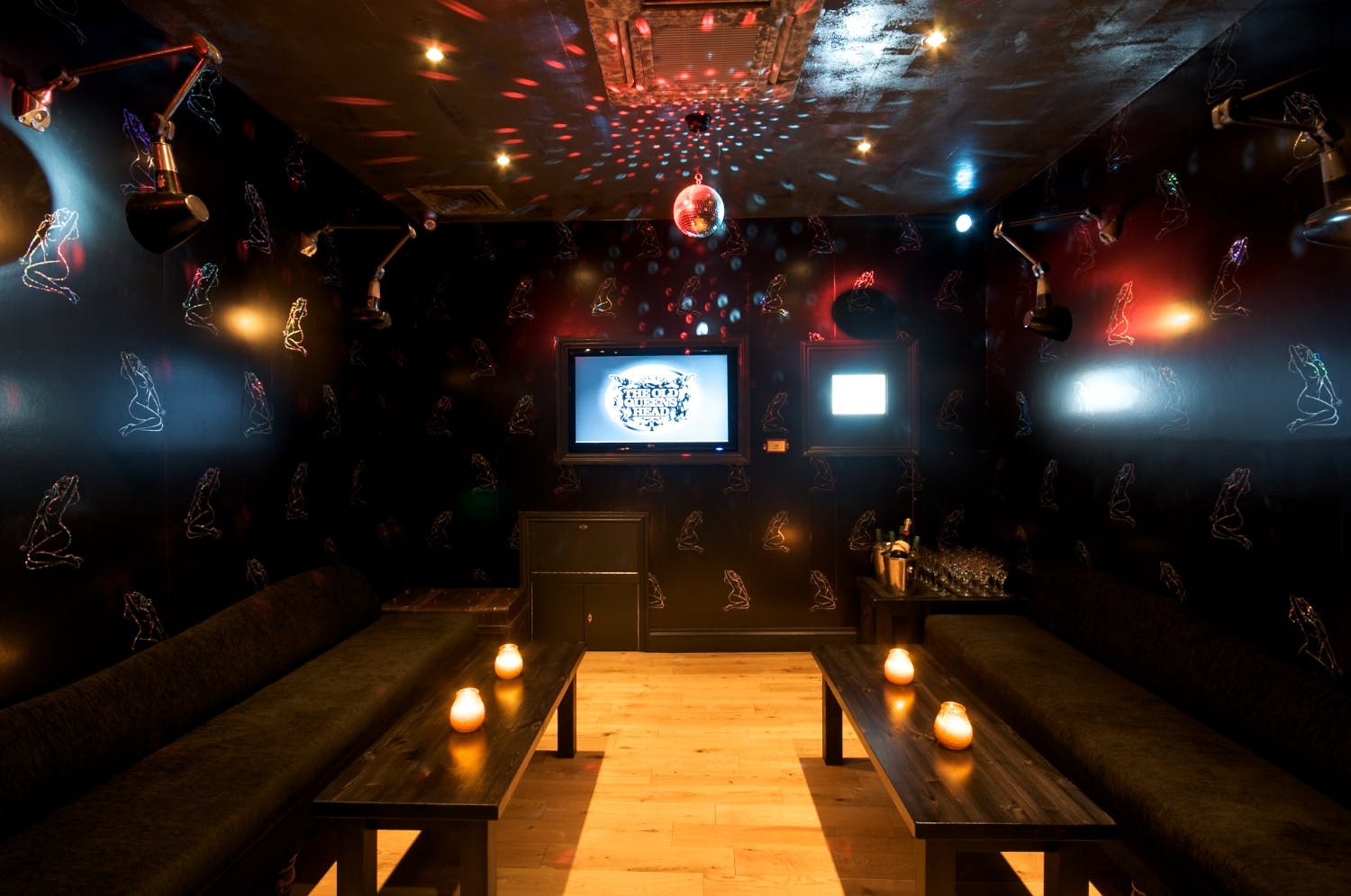 Stylish karaoke room with disco ball, perfect for parties and gatherings.