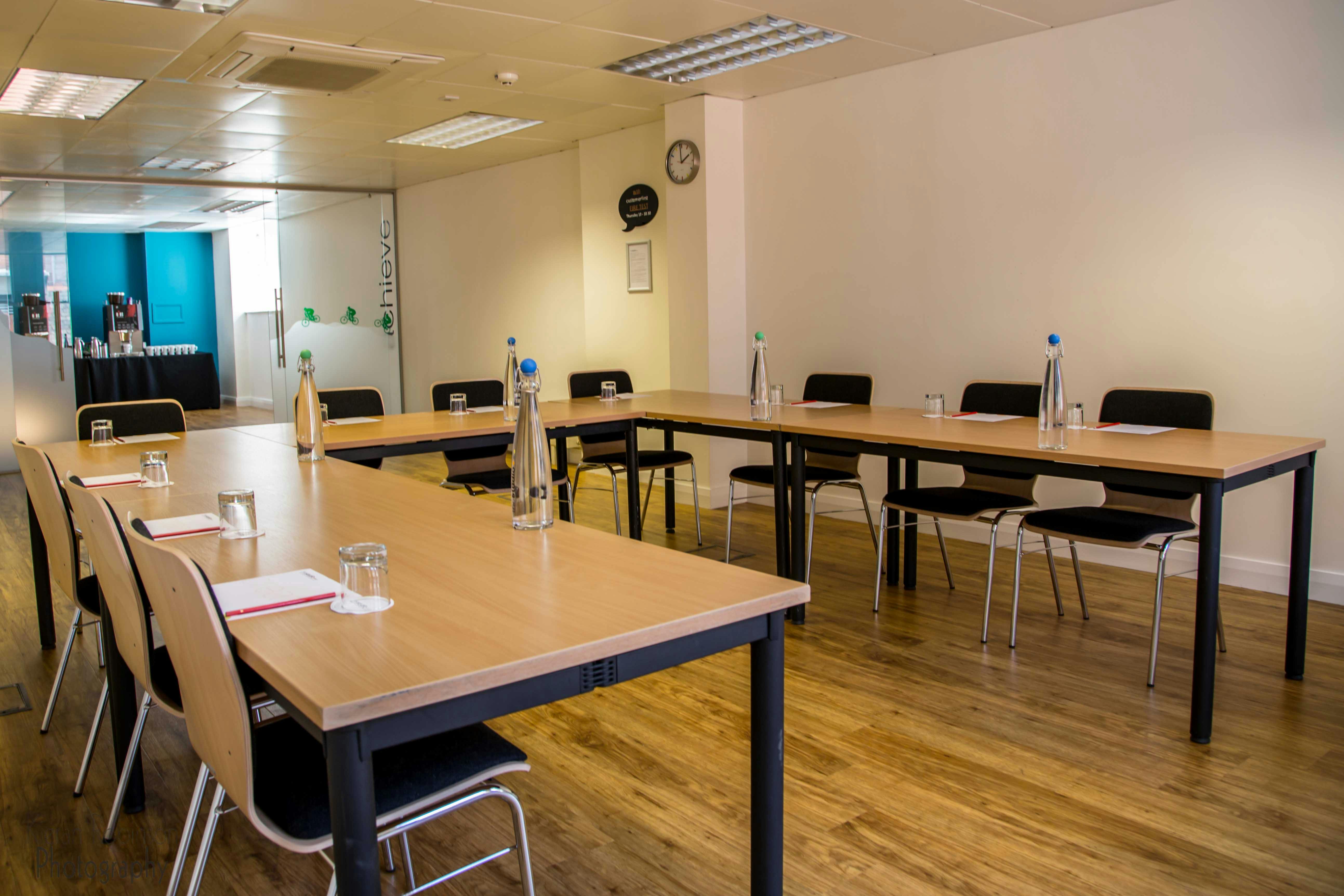 Professional meeting room in Birmingham with natural light, ideal for corporate events.