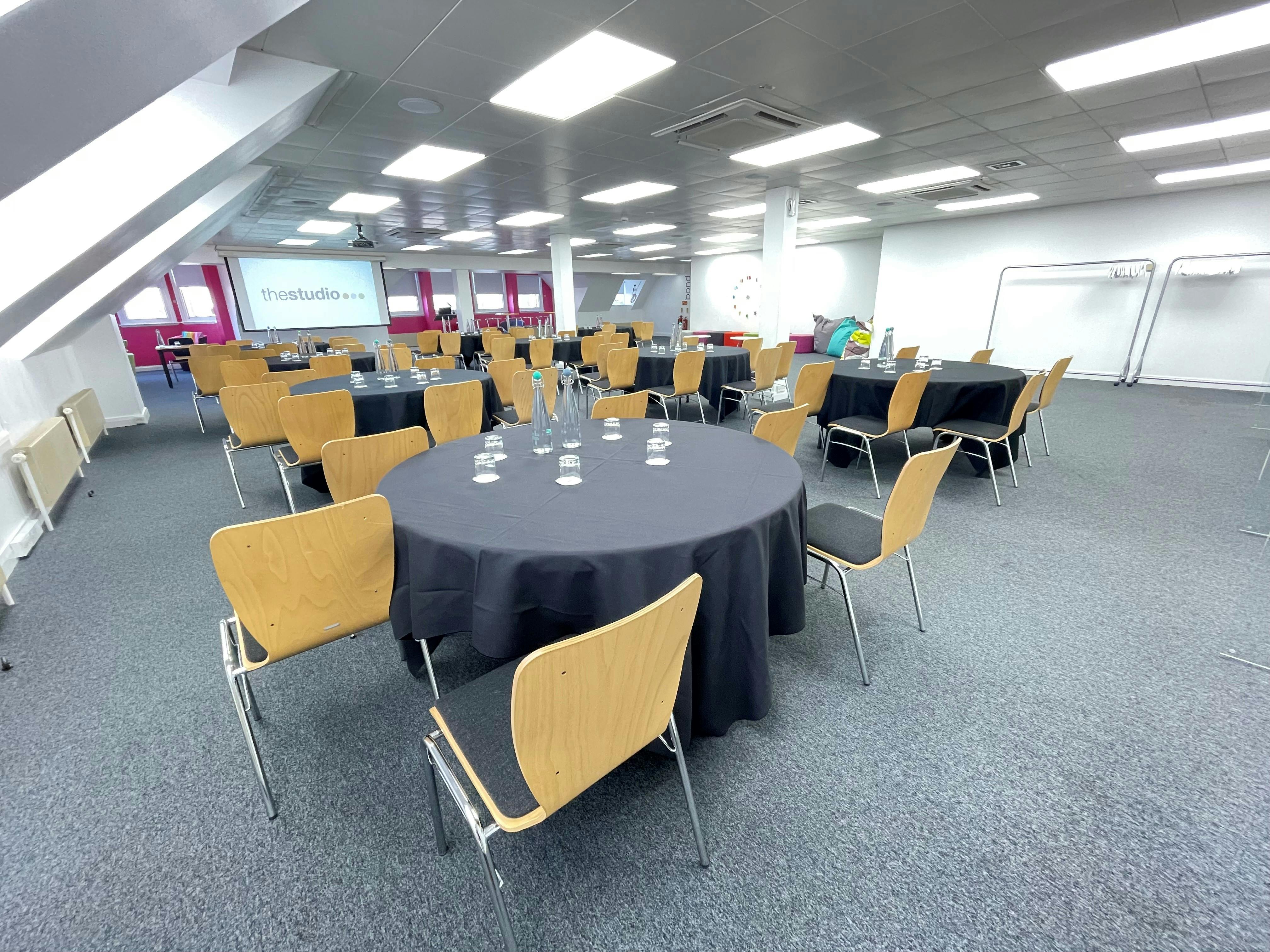 Versatile Birmingham event space with round tables, ideal for meetings and conferences.