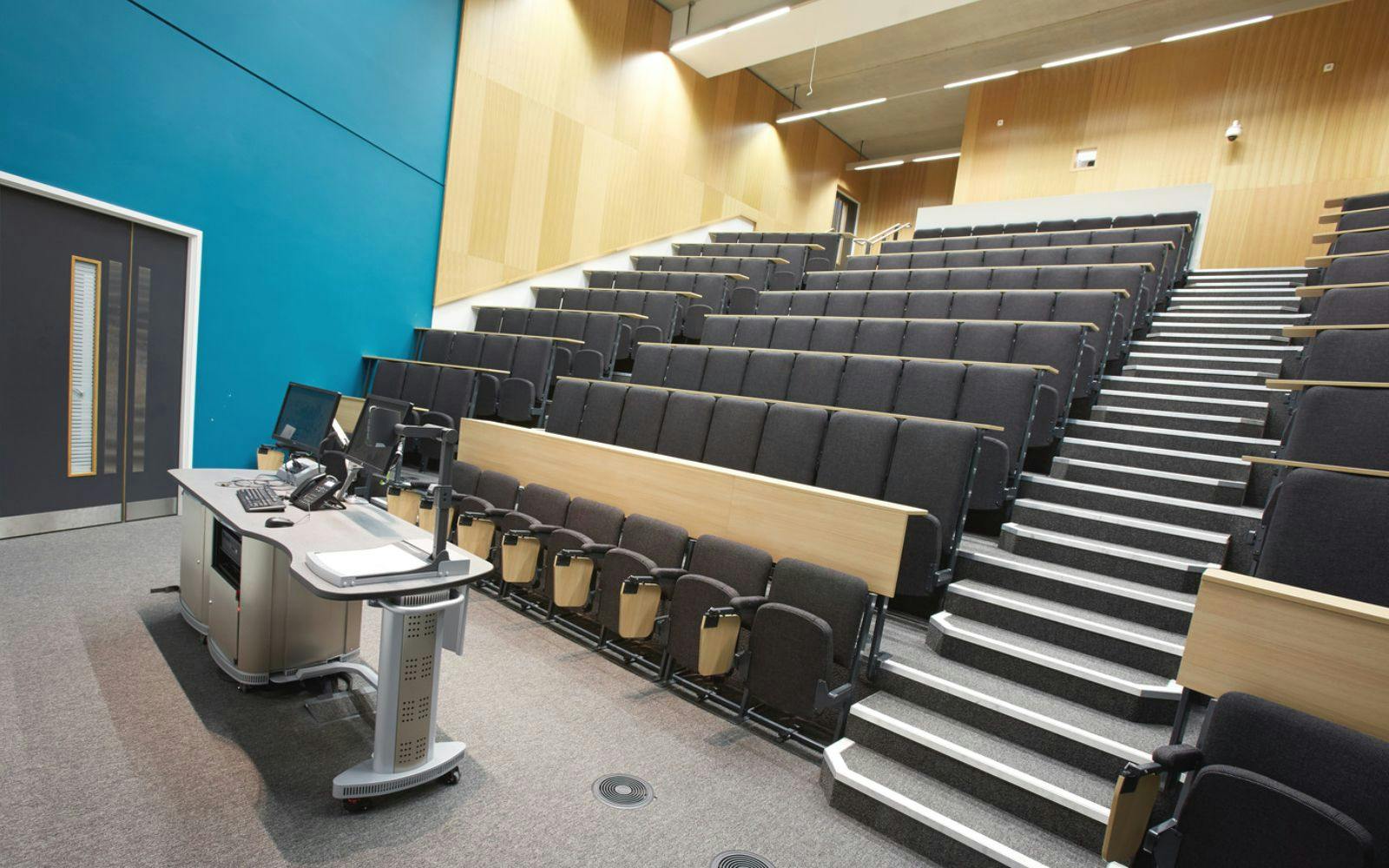 Modern auditorium with tiered seating in Brooks Building for corporate meetings and seminars.