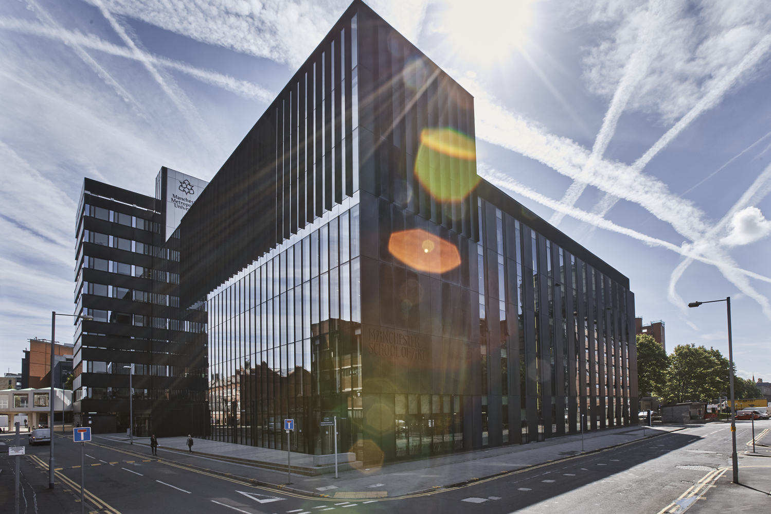 Modern Benzie Building meeting space with glass facade, ideal for corporate events and conferences. - Banner