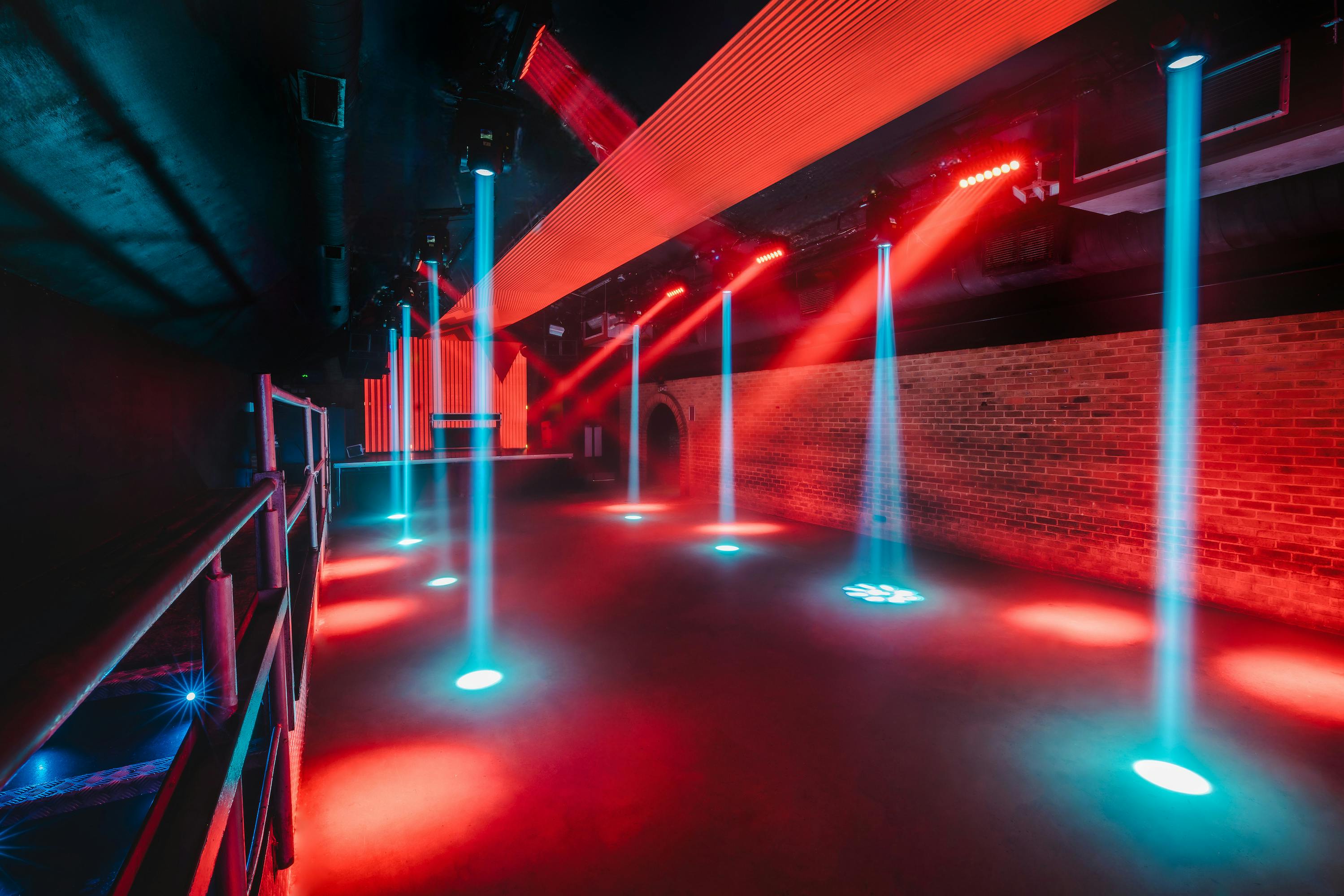 Fire in Vauxhall Arches: vibrant event space with dynamic lighting for corporate and social gatherings.