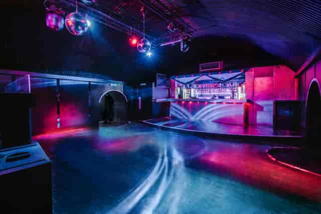 Vibrant Vauxhall Arches event space with colorful lighting for nightlife and parties.