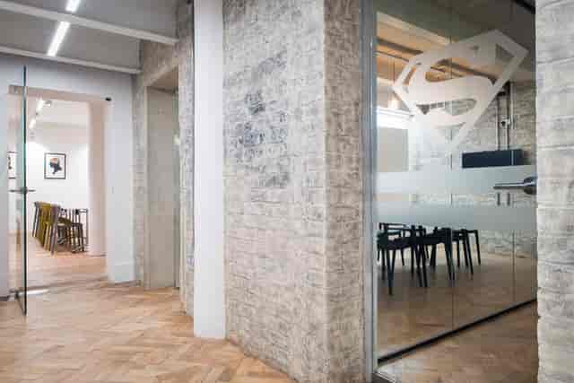 Industrial-chic studio breakout space for professional workshops and team meetings.