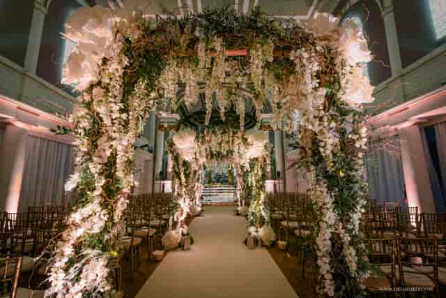 Soane Hall wedding venue with floral aisle and elegant seating arrangement.