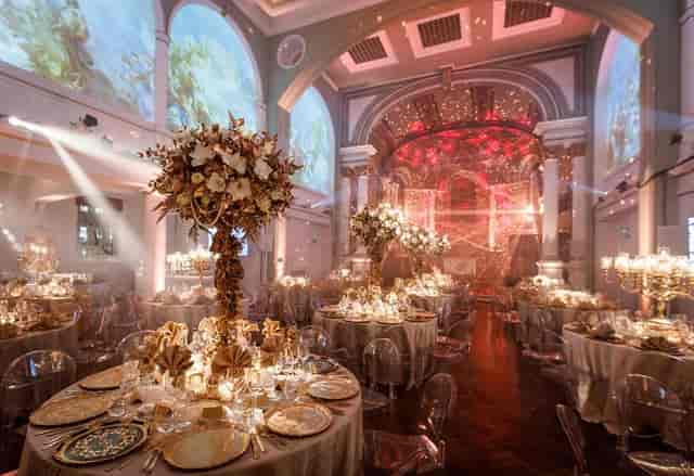 Soane Hall gala event featuring grand floral centerpieces, ambient lighting, and panoramic AV.