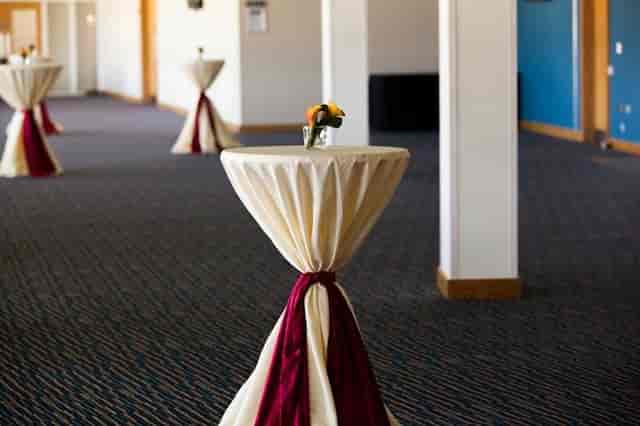 Spacious Edgbaston Stadium event venue with cocktail tables for networking gatherings.