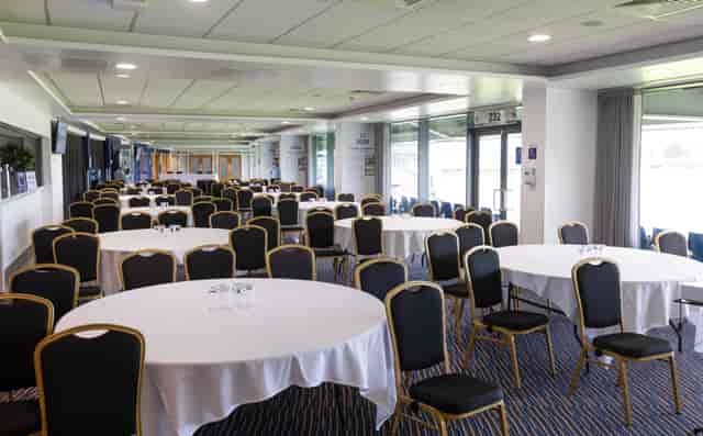 Members Lounge at Edgbaston Stadium set for corporate event or banquet with stadium views.