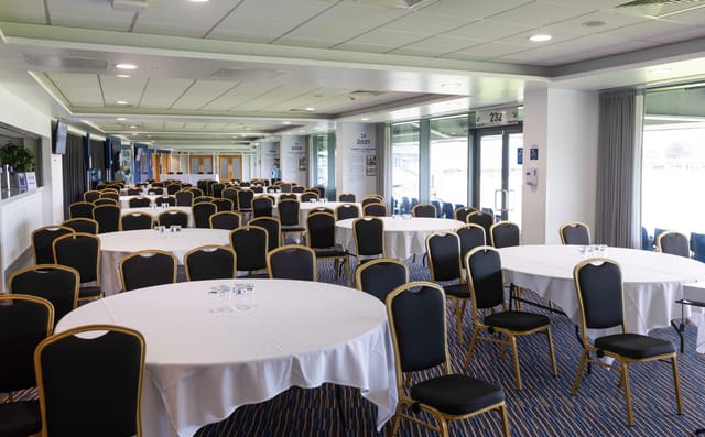 Members Lounge at Edgbaston Stadium set for corporate event or banquet with stadium views.