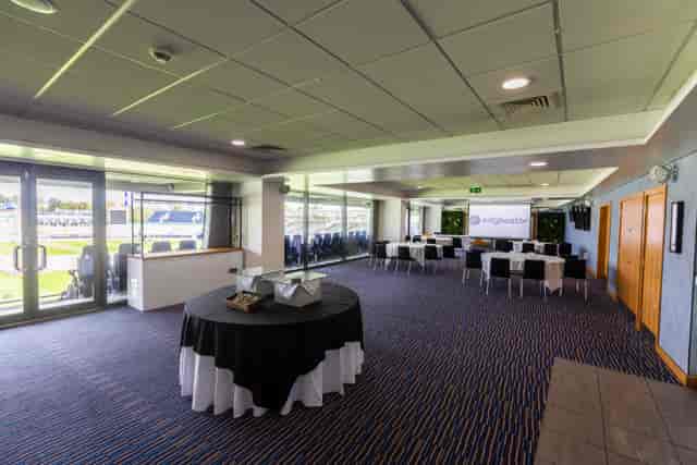 Chair's Lounge at Edgbaston Stadium: cabaret-style event space with AV setup for corporate meetings.