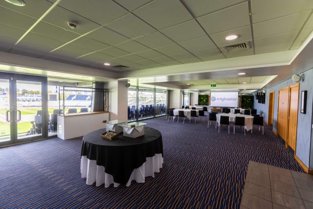 Chair's Lounge at Edgbaston Stadium: cabaret-style event space with AV setup for corporate meetings.