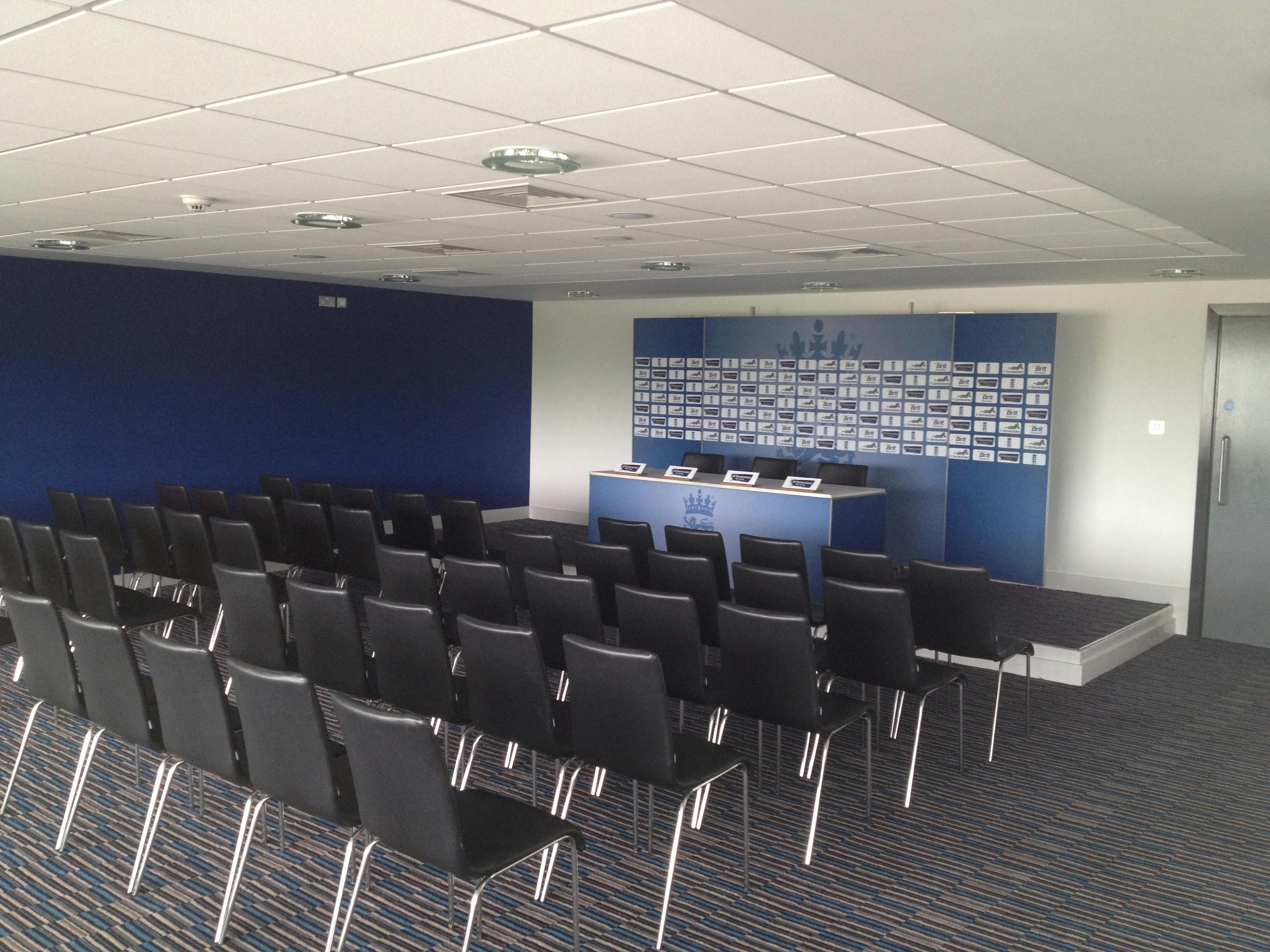 Press Lounge at Edgbaston Stadium, organized conference room for media events.