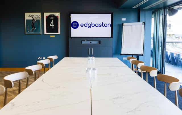 Executive boardroom at Edgbaston Stadium with pitch views for corporate events and meetings.
