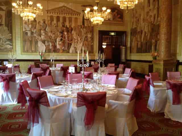 Elegant banquet room with round tables, ideal for weddings and corporate events.