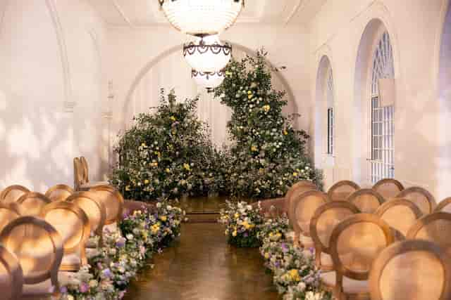 Elegant ceremony at One Marylebone with organic floral arches for luxury weddings and events.
