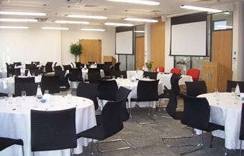 Roddick Conferencing Suite with round tables, ideal for meetings and networking events.