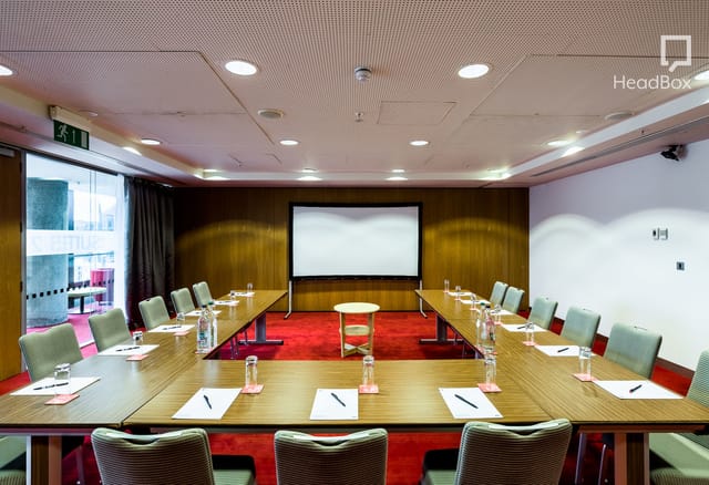 Meeting room with U-shape seating at Unique Venues Birmingham for corporate events.