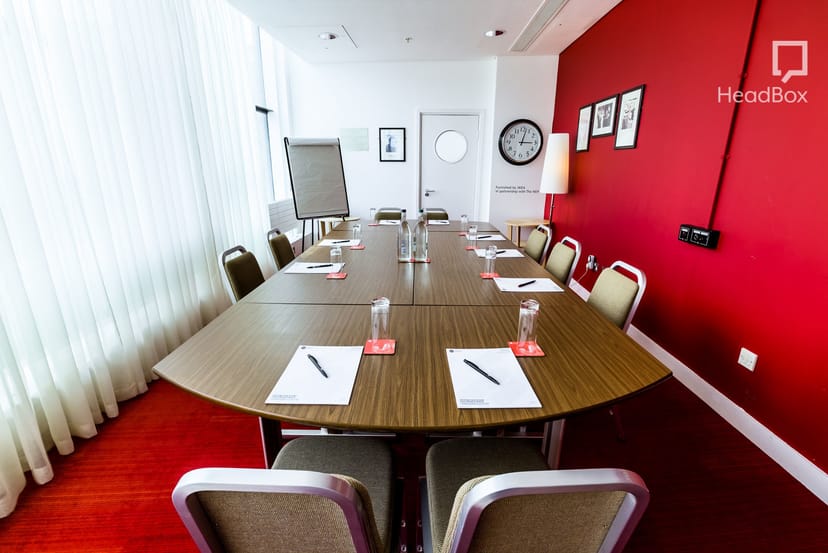 Winteringham Room at Unique Venues Birmingham, polished table for corporate meetings.