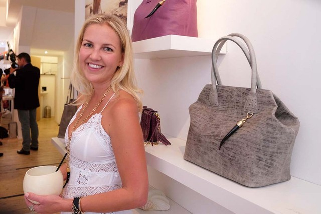 Chic event setting with luxury handbags for a stylish product launch or boutique opening. - Banner