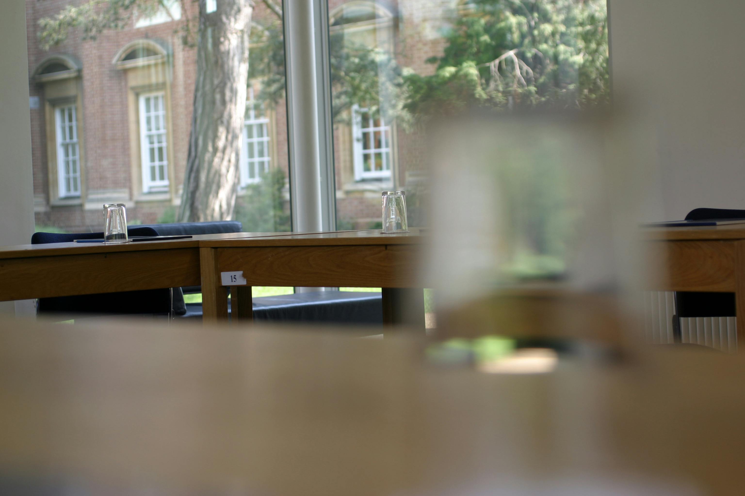 Maplethorpe Seminar Room at St Hugh's College, ideal for workshops with wooden tables.