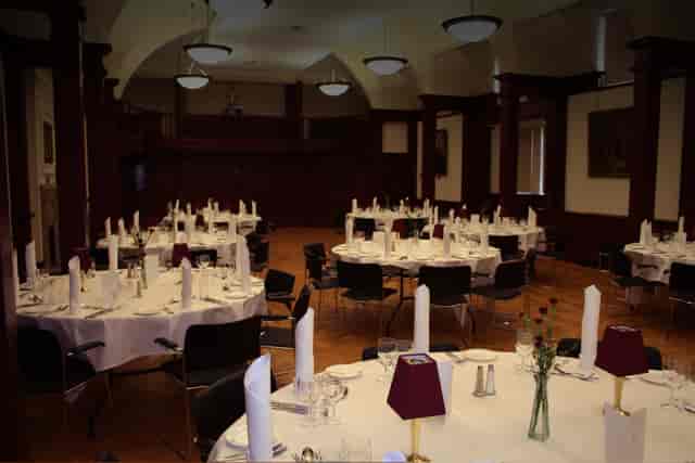 Mordan Hall event space with round tables, ideal for formal gatherings and banquets.