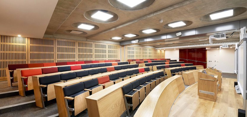 Dickson Poon Lecture Theatre with tiered seating for events and presentations at St Hugh's College. - Banner