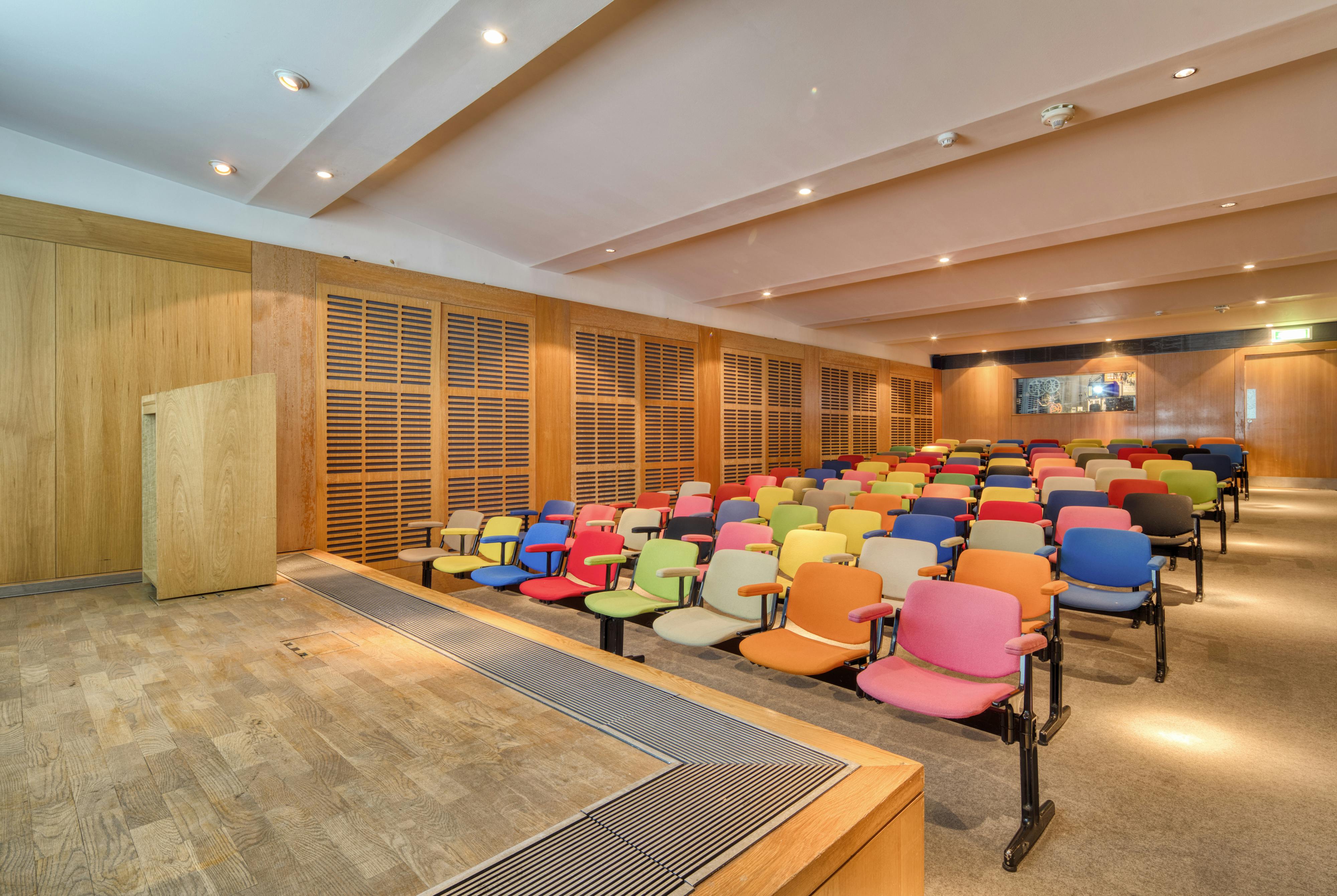 Zilkha Auditorium at Whitechapel Gallery: modern conference room with vibrant seating for events.