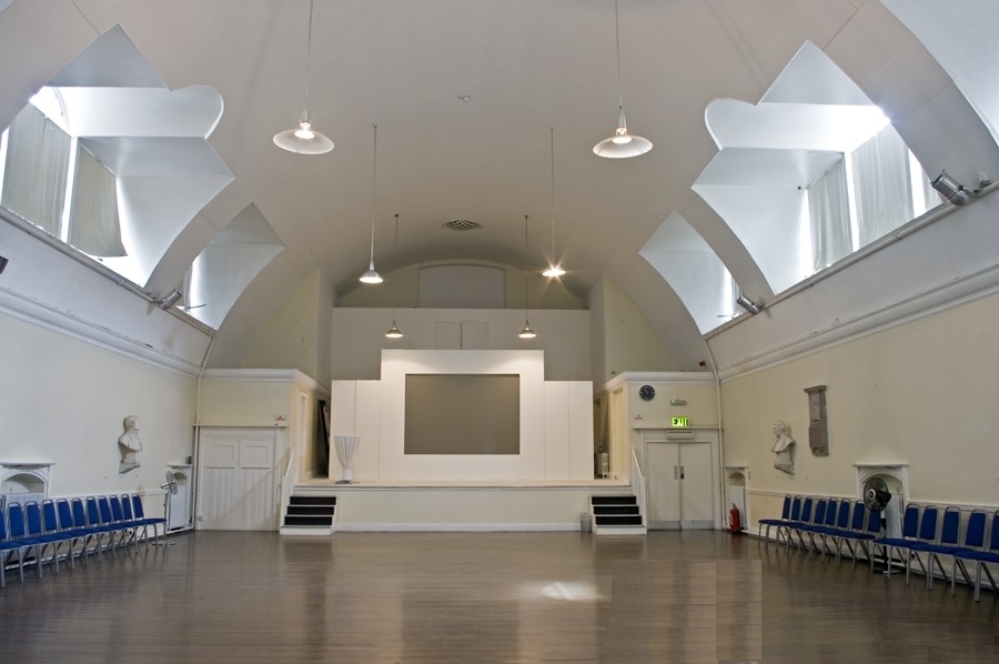 Spacious Mary Ward Hall with high ceilings, ideal for conferences and workshops. - Banner