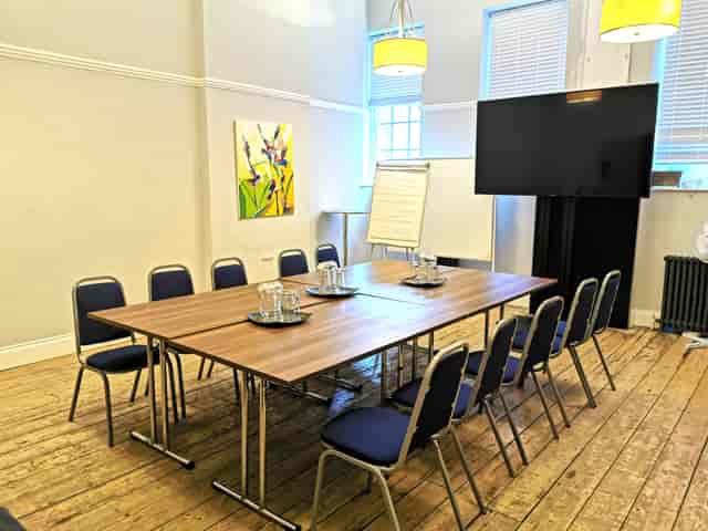 Boardroom at Mary Ward House with modular tables for professional strategy sessions and workshops.