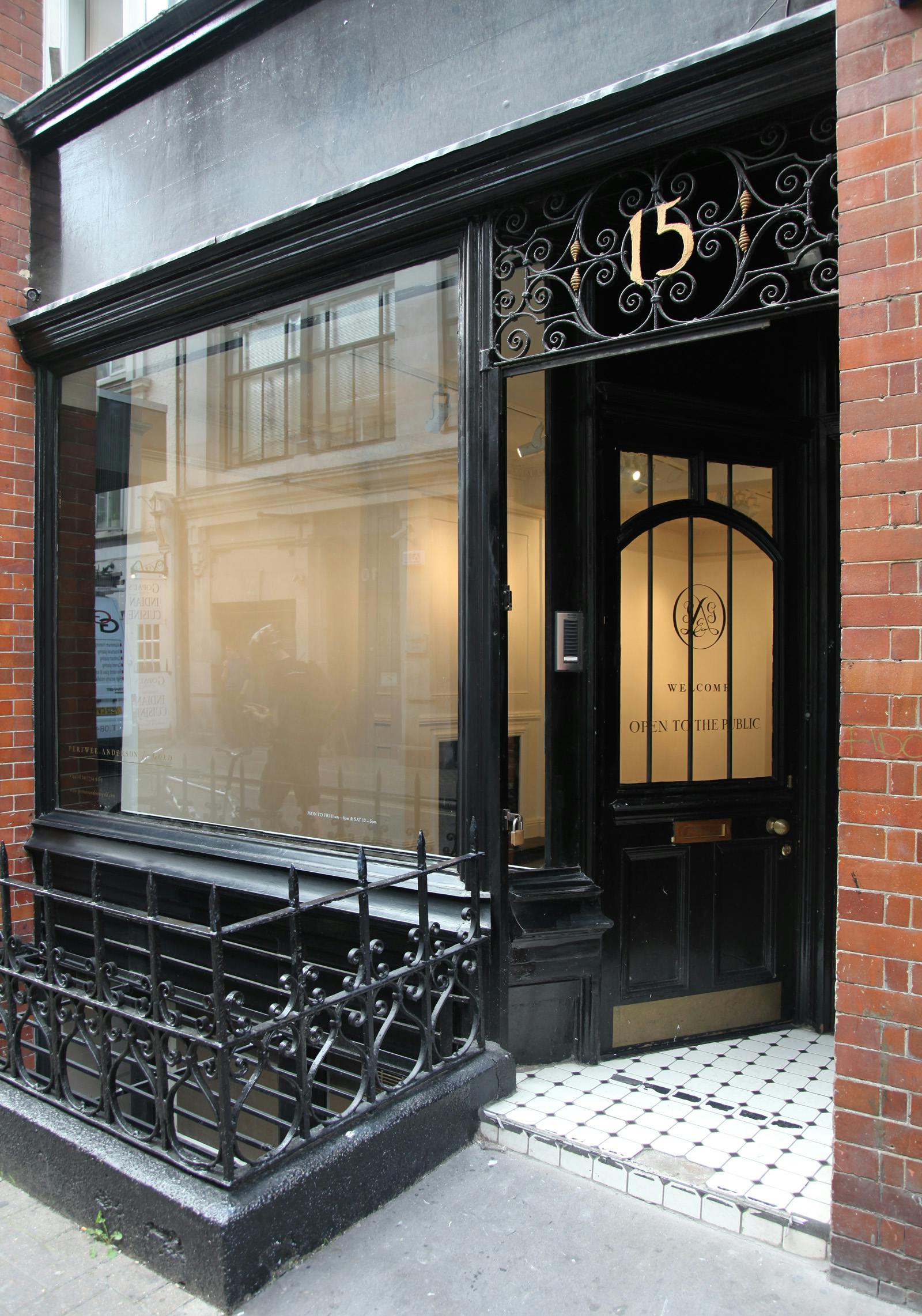 Modern venue entrance with large glass windows for corporate meetings and events.