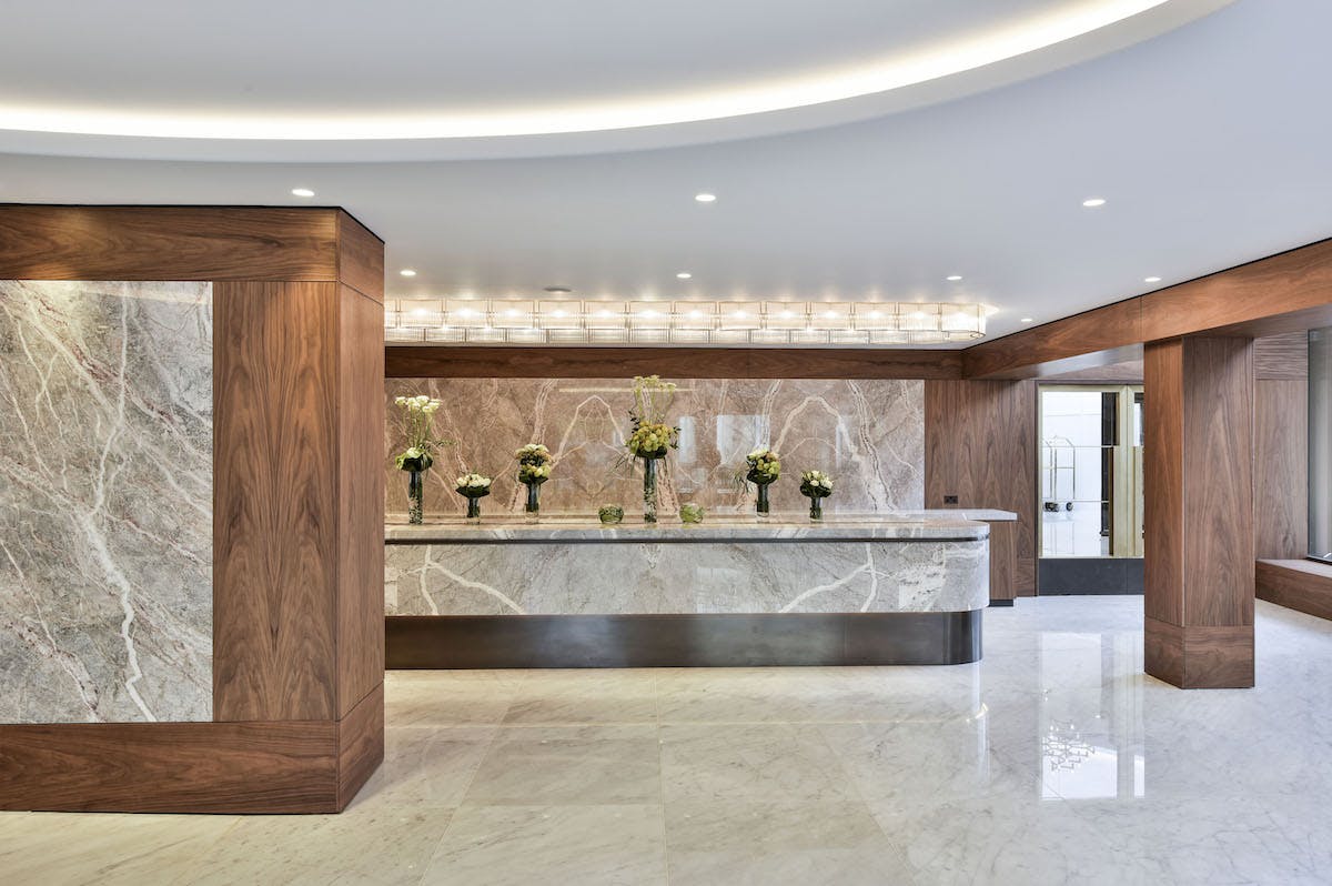 Nine Kings Suite reception, modern marble decor for corporate events, luxury hospitality.