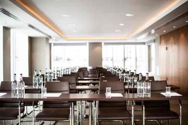 Oak Suite boardroom setup with natural light for professional meetings and corporate training.