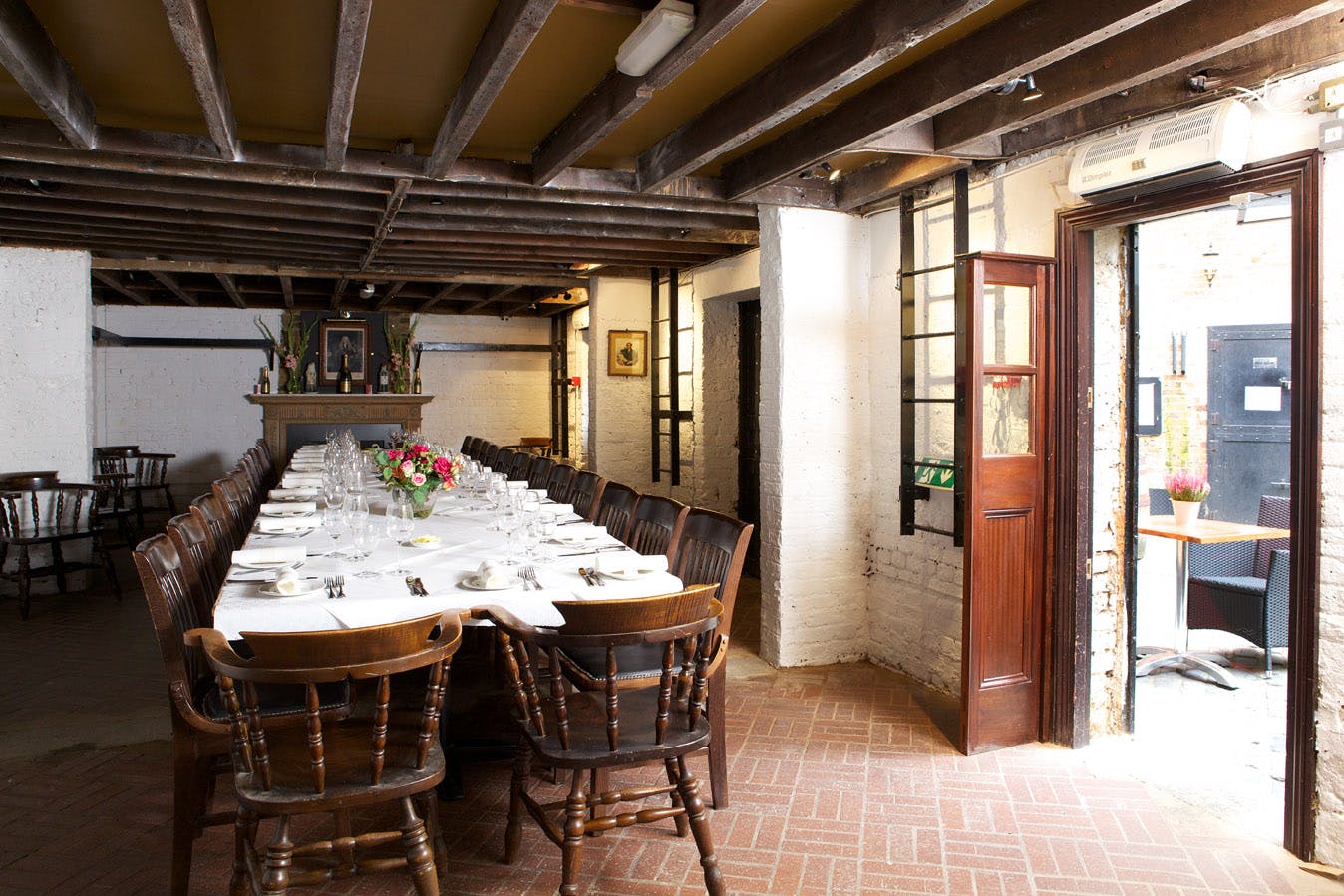 The Ovens dining space with rustic decor, perfect for intimate gatherings and corporate events.