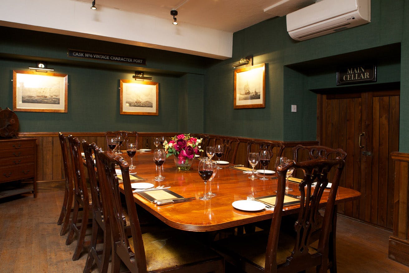 Elegant meeting room with wood furnishings, ideal for corporate events and gatherings.