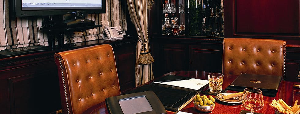 Boardroom at Hotel 41 with leather seating, ideal for upscale meetings and presentations.