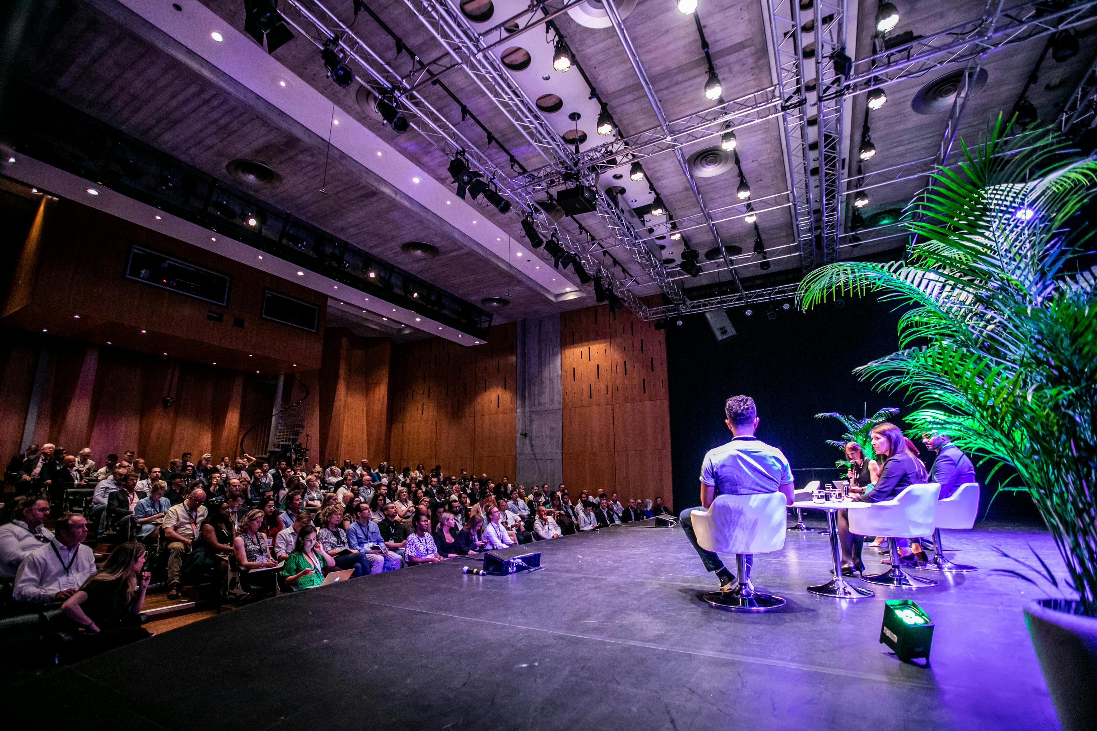 Purcell Room panel discussion with engaging speakers and inviting atmosphere.