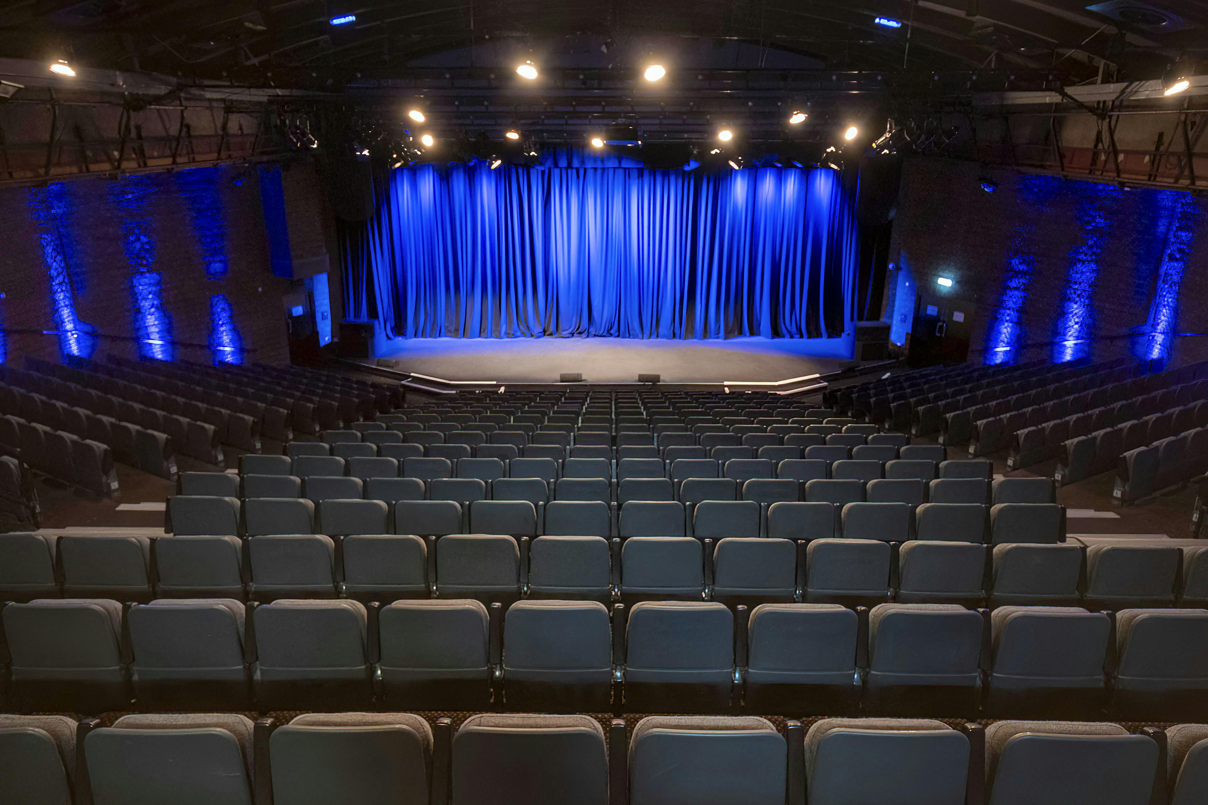 Spacious auditorium with tiered seating for conferences and performances in The Mermaid London.