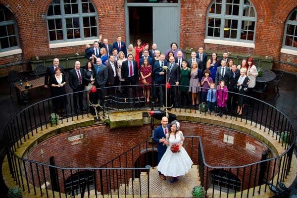 Wedding celebration at Spitbank Fort with elegant architecture and joyful guests.