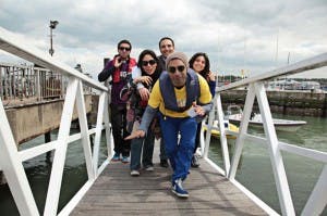 Group boarding a boat at The Courtyard, Spitbank Fort for team-building corporate retreat.