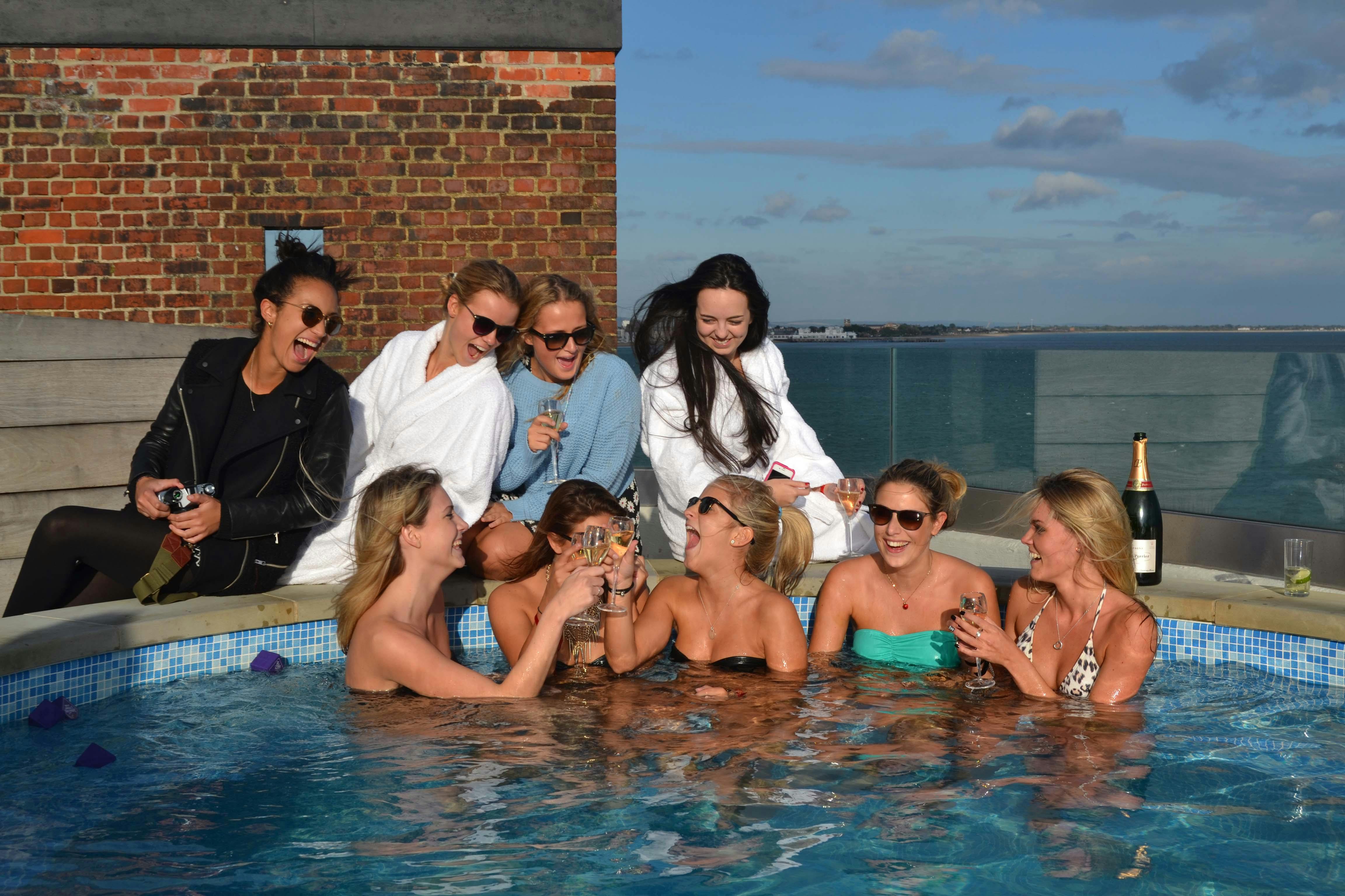 Rooftop pool party at Crow's Nest, Spitbank Fort - luxury networking celebration.