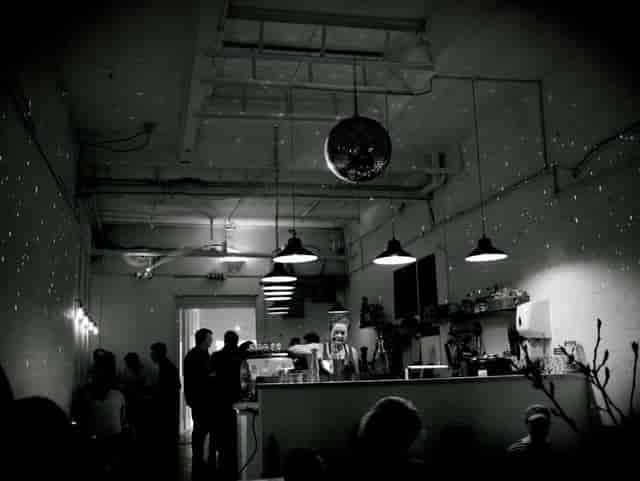 Stylish event space at Craving Coffee with disco ball, perfect for cocktail receptions.
