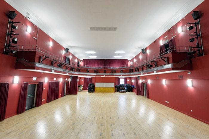 Stanley Theatre event venue, spacious with polished wood floor, ideal for performances & conferences.